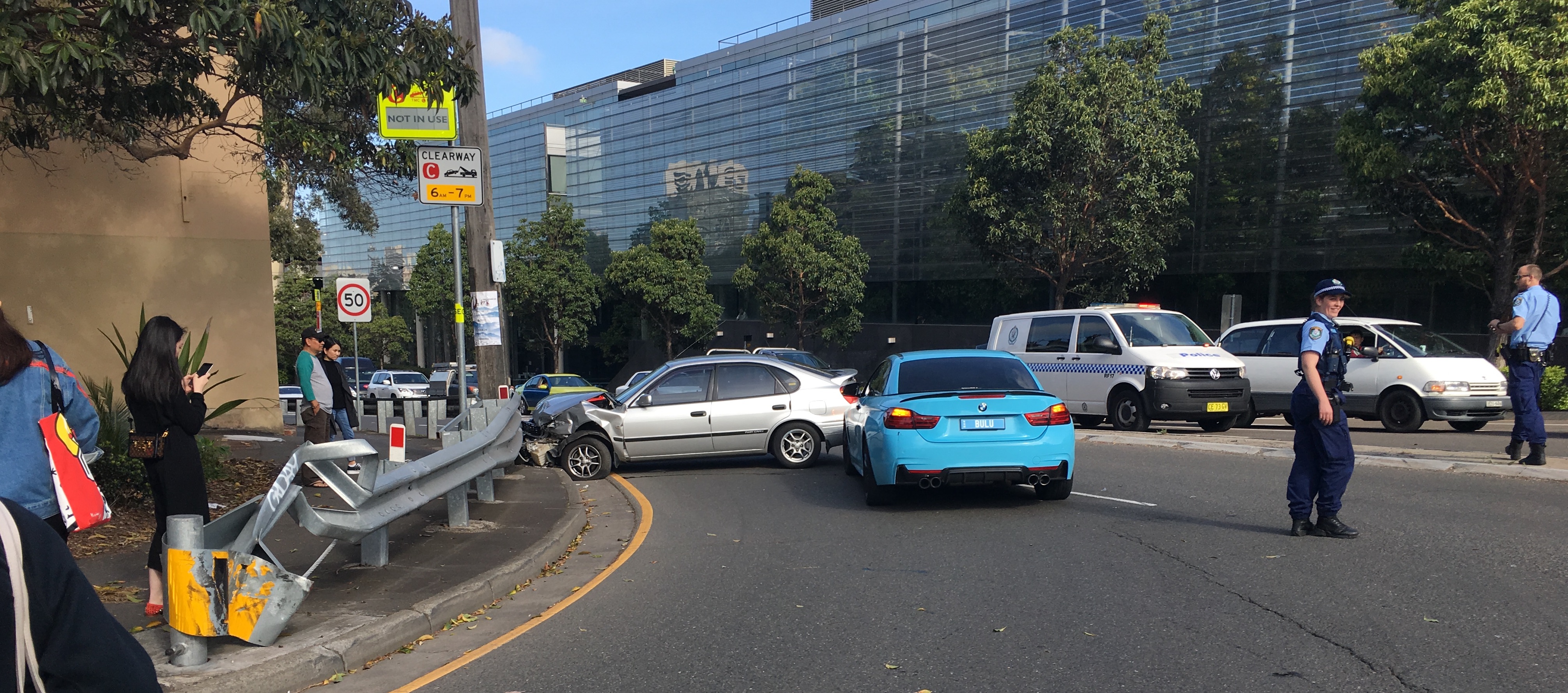 Cleveland Street at City Road crash (across the street from the discussed island, adjacent to another refugee island, for free lefts from City Road to Cleveland Street). Fortunately there was guardrail, I guess. Speed limit, 50 km/h. The police officer was not pleased by the photographers documenting the failure of traffic engineering.